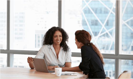 Two leaders in a one-on-one discovery conversation
