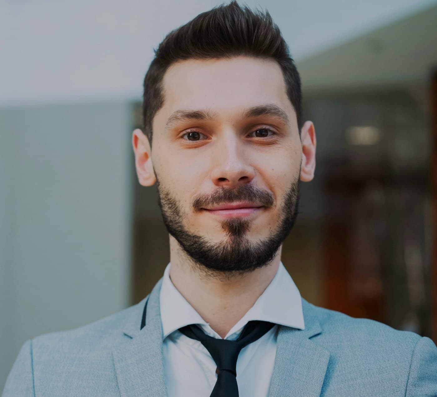 A KeyPeople Network member smiling in a modern office