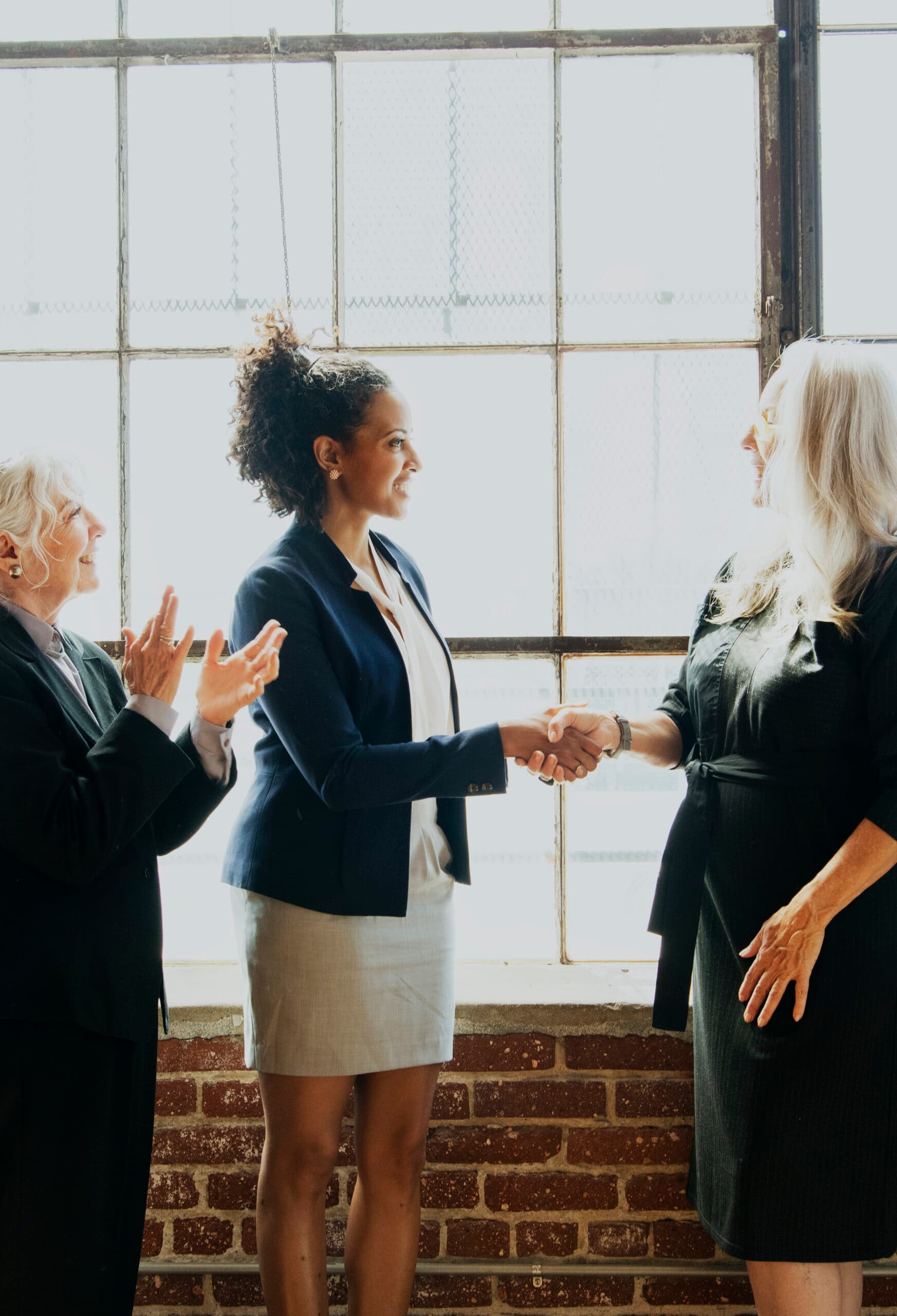 A kpCompanies placement — an executive candidate and hiring leader shaking hands